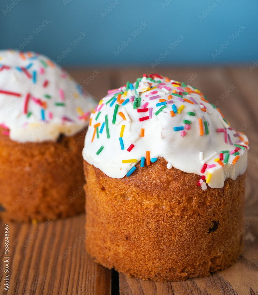 Easter cake with icing and caramel colored sprinkles, shot from a close Easter cake with icing and caramel colored sprinkles, shot from a close