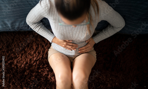 Cuadro en lienzo Young White Woman Suffering With Extreme Abdominal Menstrual Pain Cramps