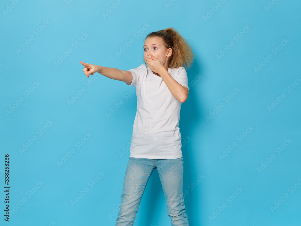 young woman pointing at something young woman pointing at something