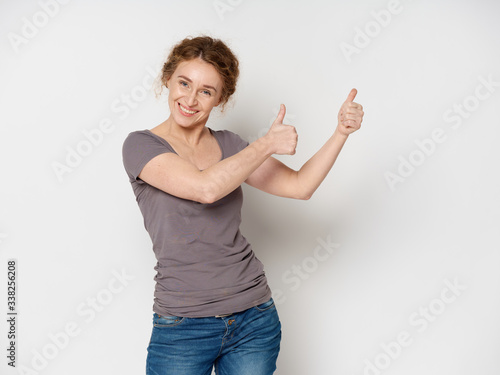 young woman pointing at something