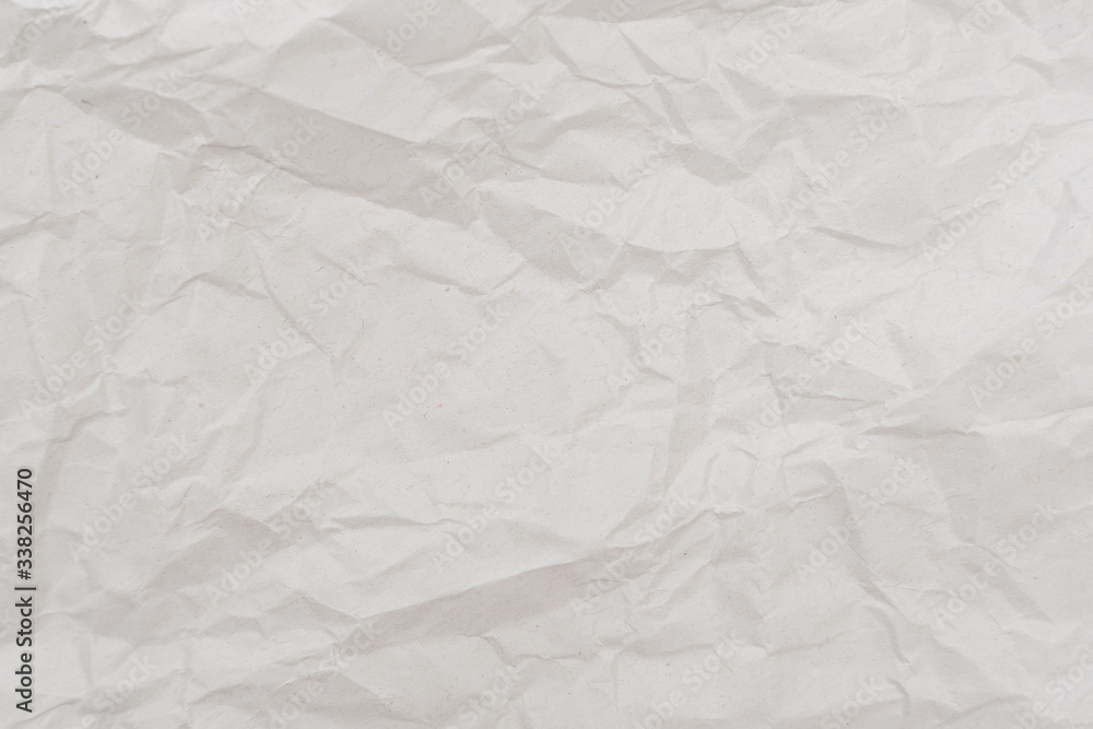 Fototapeta premium White crumpled paper texture. Abstract paper pattern for background. Close-up.