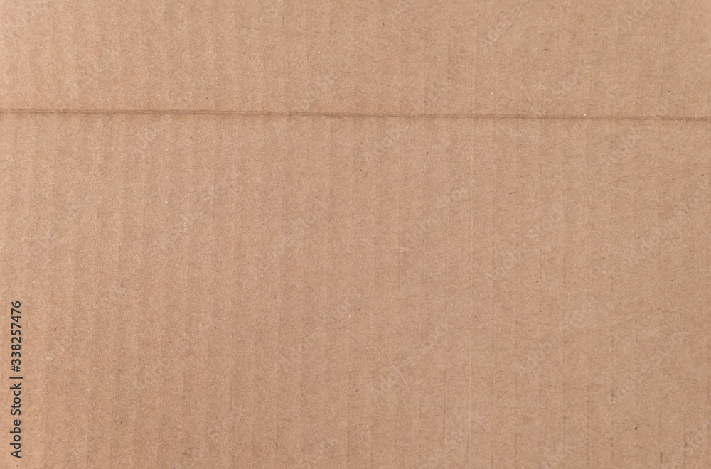 Fototapeta premium Brown cardboard sheet texture background. Texture of recycle paper box in old vintage pattern background.