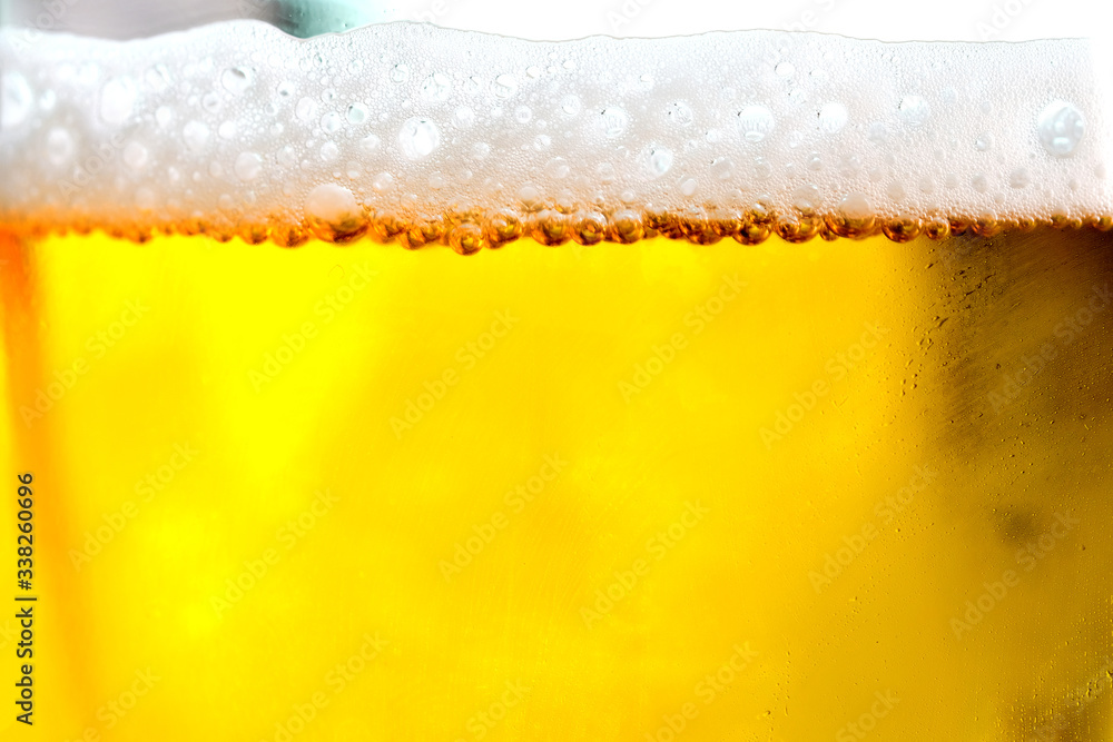 Background Cool beers with beer bubbles on top a glass at the party Background Cool beers with beer bubbles on top a glass at the party