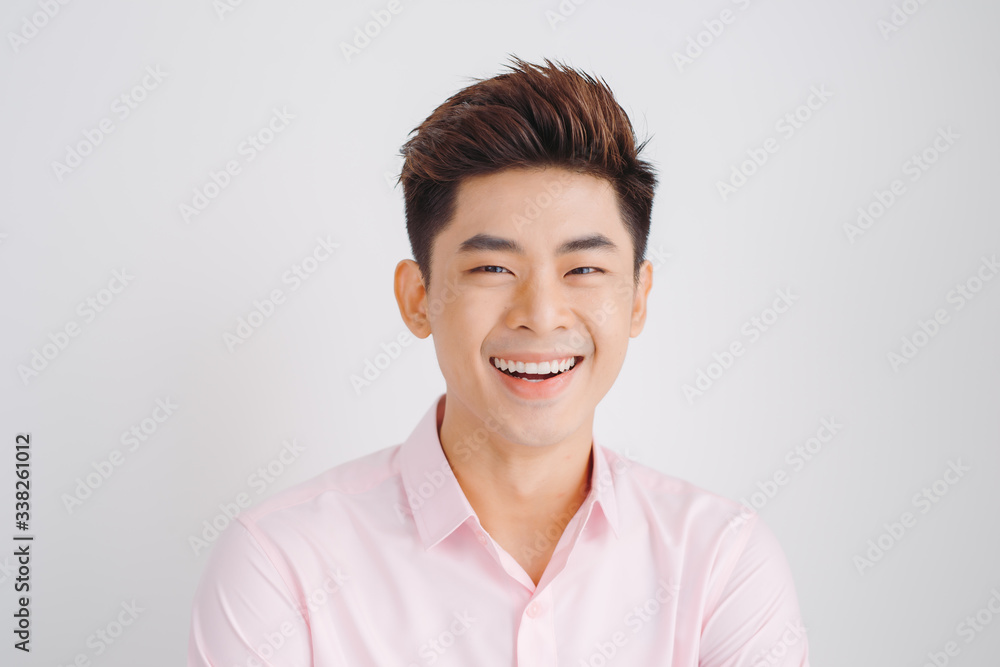 Smiling Asian man portrait over white background Smiling Asian man portrait over white background
