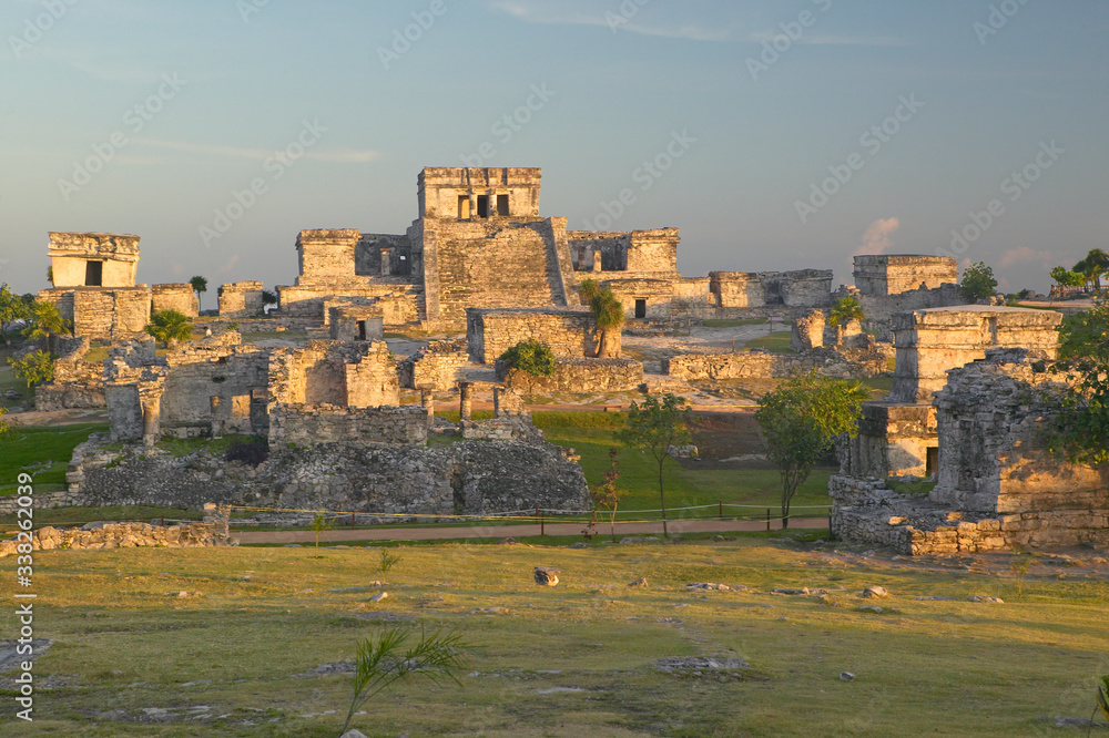 Mayan ruins of Ruinas de Tulum (Tulum Ruins) in Quintana Roo, Mexico. El Castillo is pictured in Mayan ruin in the Yucatan Peninsula, Mexico at sunset