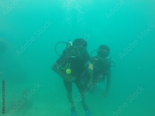 Bunch of scuba divers under water