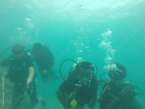 Bunch of scuba divers under water