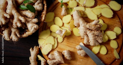 Slices of fresh ginger on the cutting Board slowly rotate.