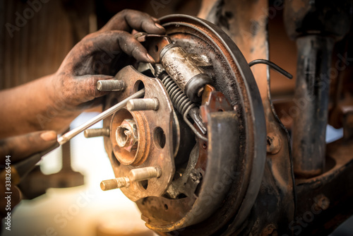Brake repair or inspections of brake systems and the replacement of new brake pads held by mechanics who change car brake pads in car repair shops