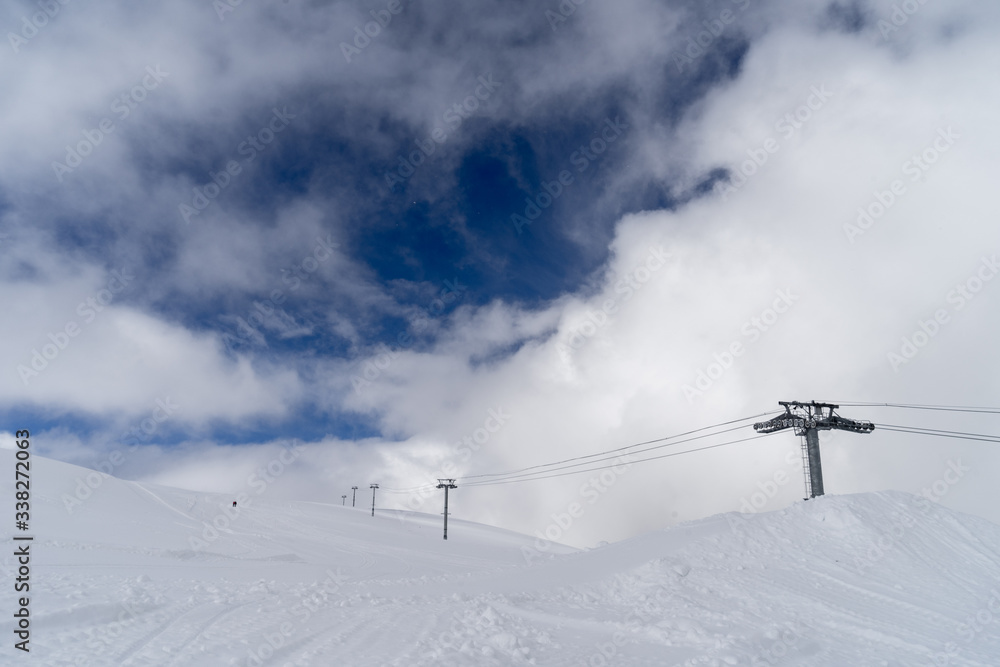 Image of a snow covered mountain plateau. Tourists walk and take pictures on a mountain plateau. Image of a snow covered mountain plateau. Tourists walk and take pictures on a mountain plateau.