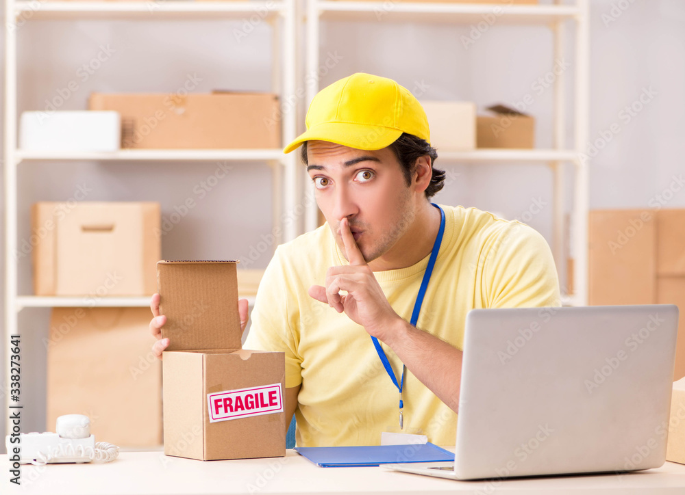 Handsome contractor working in box delivery relocation service Handsome contractor working in box delivery relocation service