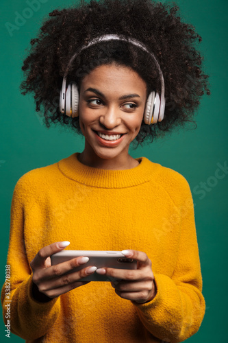 Woman listening music play games by smartphone.