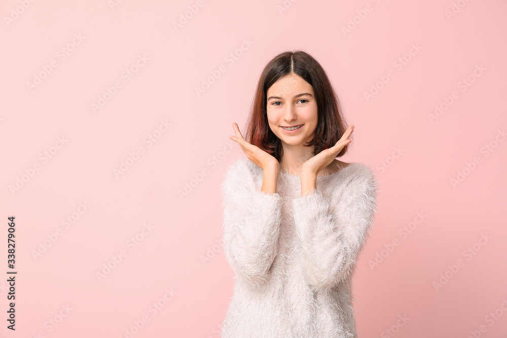 Teenage girl with dental braces on color background Teenage girl with dental braces on color background
