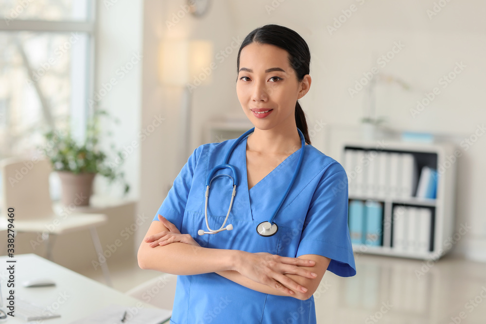 Female Asian doctor in clinic Female Asian doctor in clinic