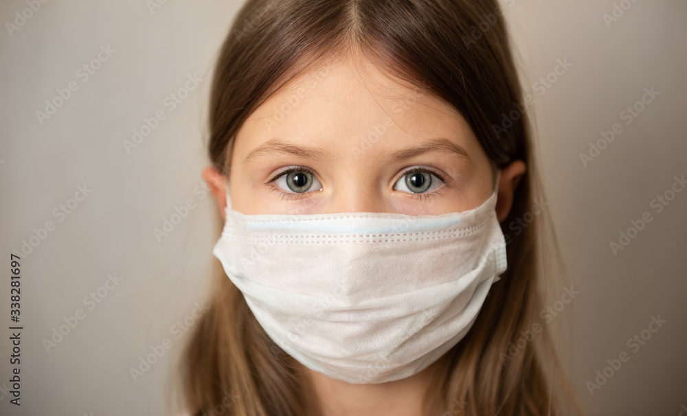 Child girl in medical mask. Coronavirus COVID-19 lockdown, panic. Vaccine from new virus