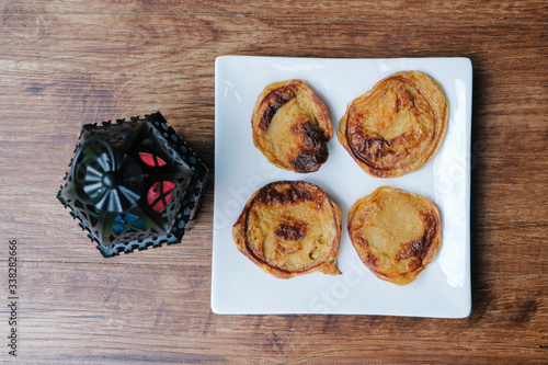 Malaysian desert called Akok Kedut on white plate. photo