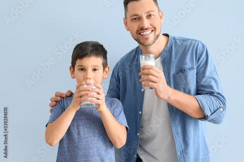 Father with son drinking mi...