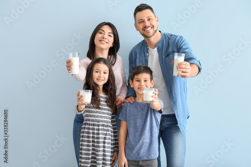 Family drinking milk on col...