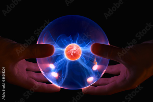 male hands with magic fire ball photo