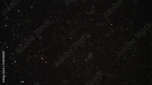 4k Natural Dust Organic Floating particles on black background. Dust in air atmosphere for your projects  Just drop it over your footage and use blending  screen  mode
