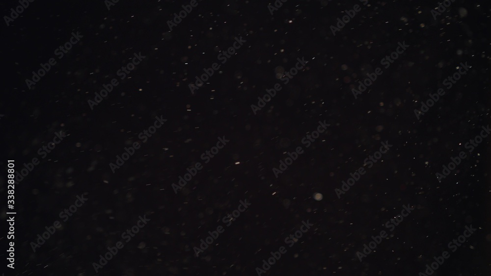 4k Natural Dust Organic Floating particles on black background. Dust in air atmosphere for your projects! Just drop it over your footage and use blending (screen) mode