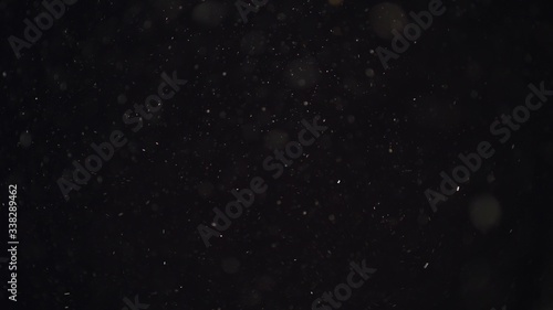 4k Natural Dust Organic Floating particles on black background. Dust in air atmosphere for your projects! Just drop it over your footage and use blending (screen) mode