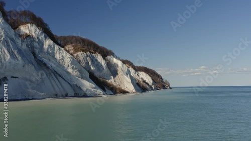 Amazing Geocenter Moens klint with tall white cliffs and the turquoise Baltic sea photo