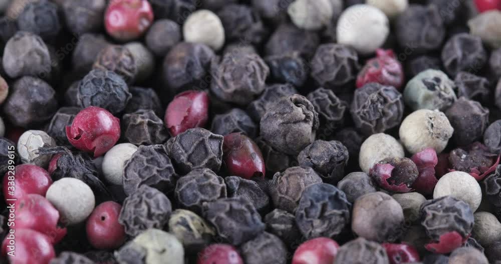 Black, white and red dry pepper background, rotation Black, white and red dry pepper background, rotation