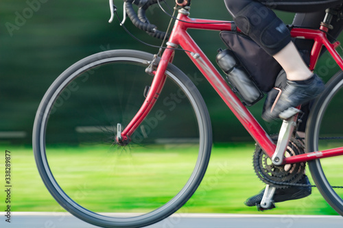 Riding bicycle - blurred motion, fast driving.