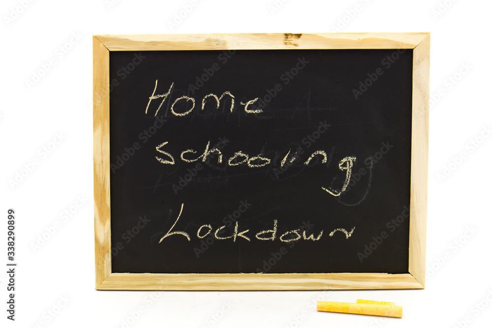 Small blackboard with the words home schooling written on it isolated on a clear background in horizontal format Small blackboard with the words home schooling written on it isolated on a clear background in horizontal format
