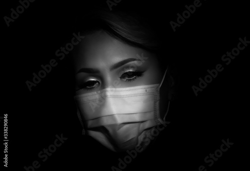 Young female cabin crew or flight attendant wearing a face mask due to the corona cov19 crisis. Woman wearing mouth protection. health protection against corona virus. Sad girl with face mask. photo