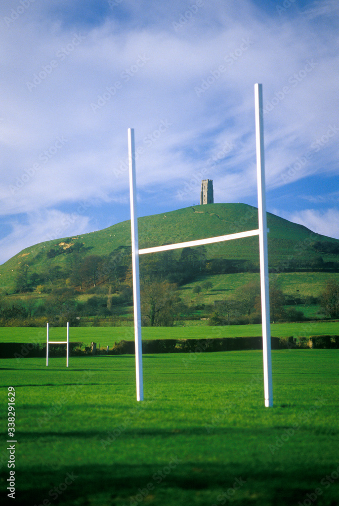 Glastonbury Tor, A sacred site along the English countryside in Glastonbury, England and goal posts in green field