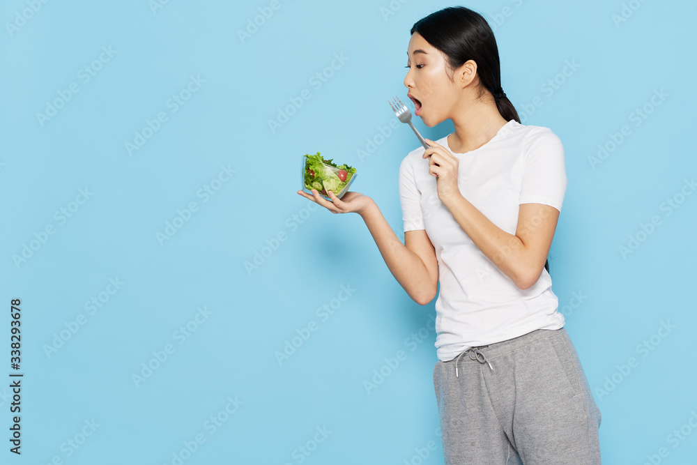 young woman holding a green plant young woman holding a green plant
