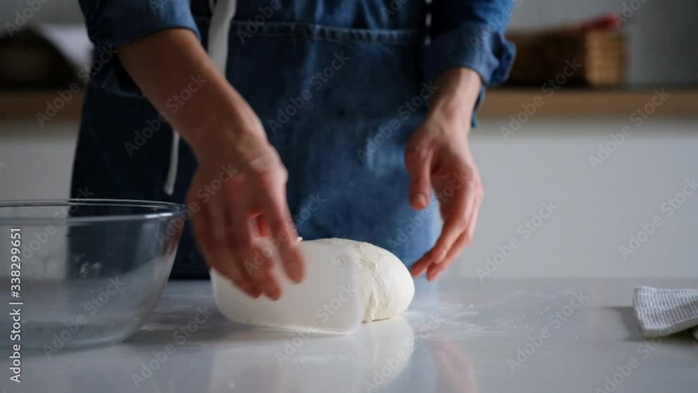 Woman puts dough in a glass bowl. Bread. 4K Woman puts dough in a glass bowl. Bread. 4K