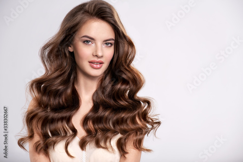 Portrait of a beautiful woman with a long brown hair.