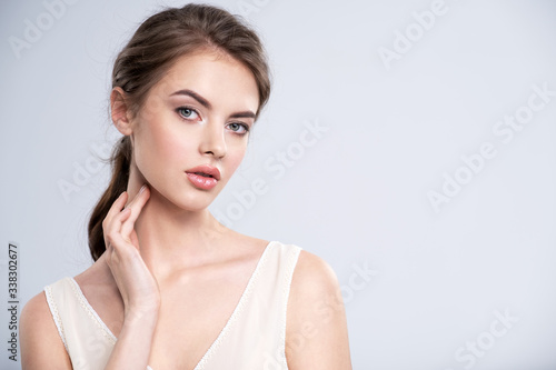 Fotografie Portrait of a beautiful young woman with a brown hair.