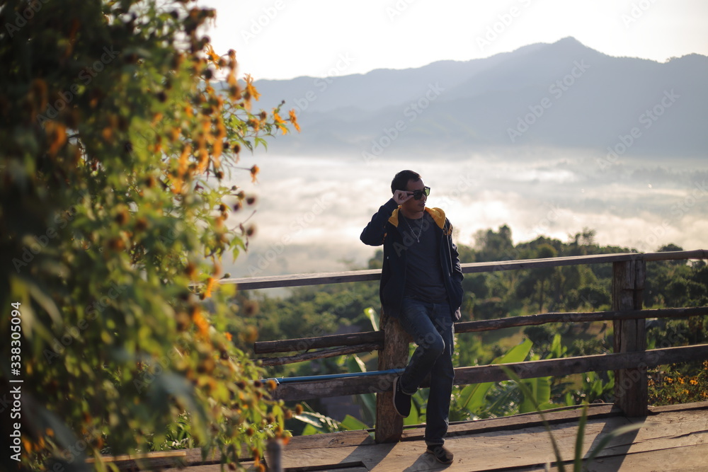 Fototapeta premium Men enjoy the view of Phu Lanka in the morning in Phayao, Thailand