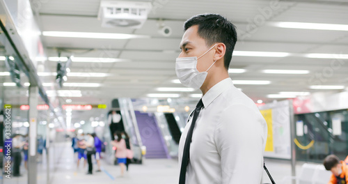 man with mask in station