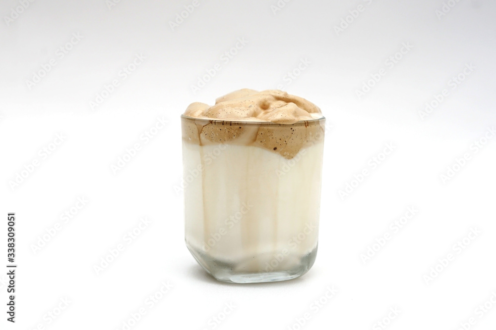 A glass of Dalgona coffee Korea favorite and good cool drink, Isolated white background A glass of Dalgona coffee Korea favorite and good cool drink, Isolated white background