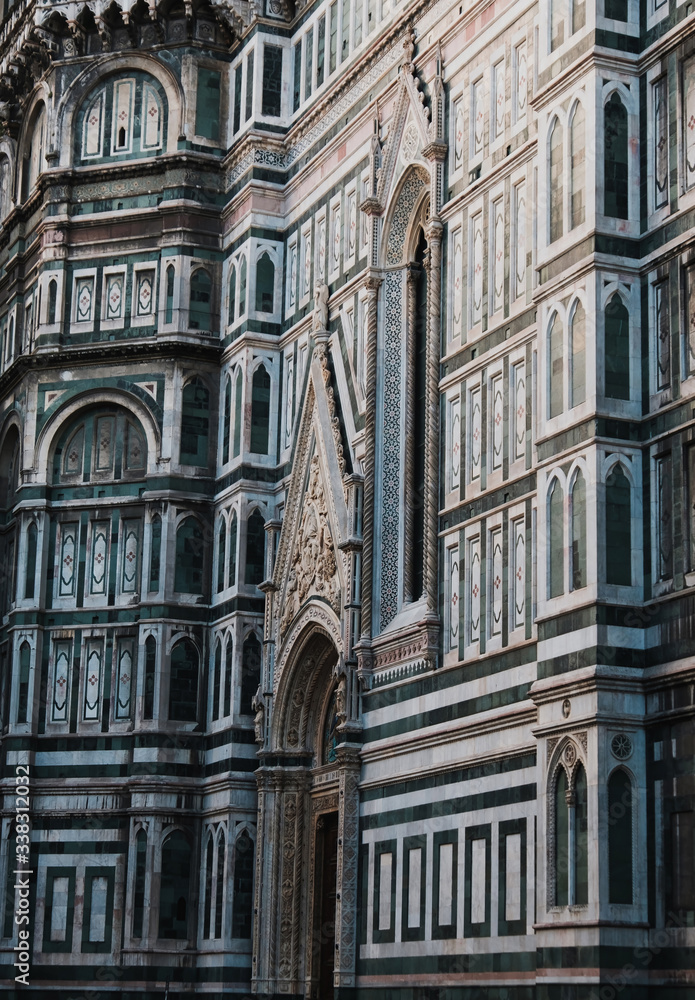Santa Maria del Fiore Cathedral, beautiful detailed view, Florence, Tuscany, Italy. Piece of art, and part of Unesco. Structure and marble walls. Vertical amazing shot. 
