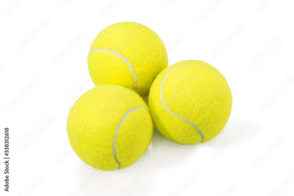 several tennis balls in on white