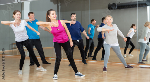 Adult people training in dance studio