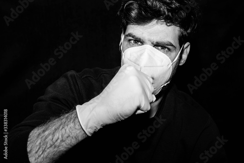 Hombre con tos, guantes y mascarilla photo