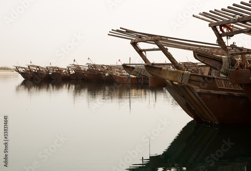 Konstfotografi Traditional Fishing boat, dhows parked in the fishing harbor, Bahrain