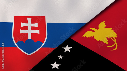 The flags of Slovakia and Papua New Guinea. News, reportage, business background. 3d illustration photo