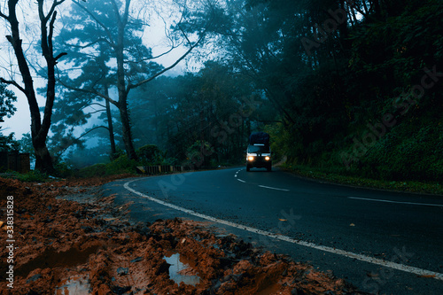 A Mountain Road Amidst The Clouds & Fog