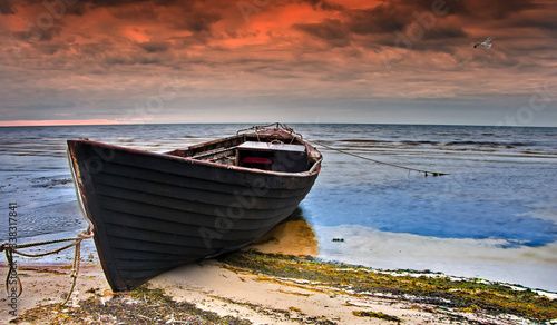 Coastal landscape with old fishing boat at dawn, Baltic Sea,  