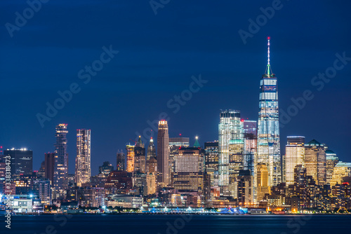 new york,usa, 08-25-17: new york city skyline  at night with reflection in hudson river. © checubus