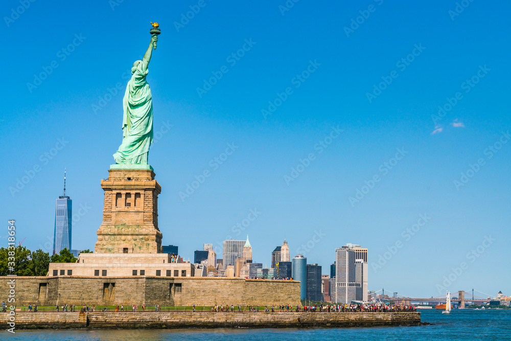 The statue of Liberty with blue sky background. The statue of Liberty with blue sky background.