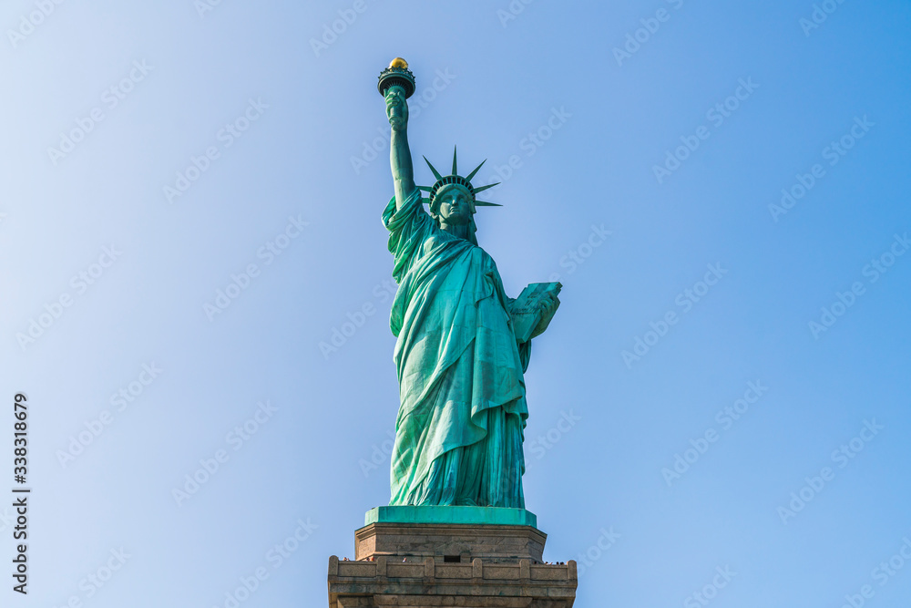 Fototapeta premium The statue of Liberty with blue sky background.